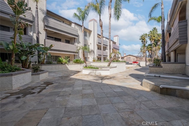 surrounding community with a patio area and a residential view