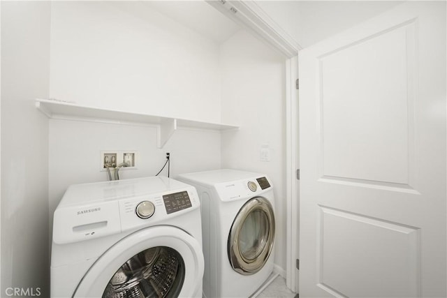 laundry area with laundry area and separate washer and dryer