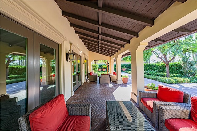 view of patio featuring an outdoor living space and french doors