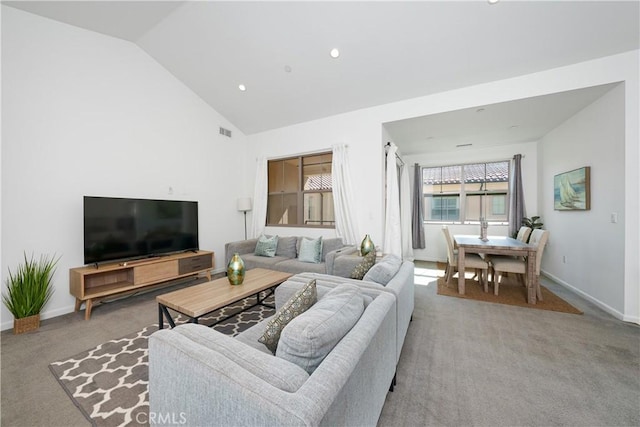 carpeted living room with baseboards, visible vents, vaulted ceiling, and recessed lighting