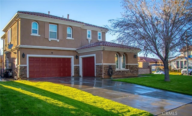 mediterranean / spanish-style home featuring a tile roof, stone siding, driveway, stucco siding, and a front lawn