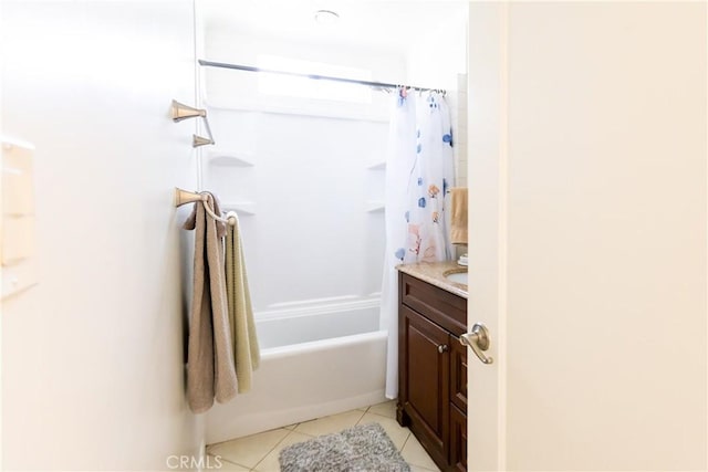 full bath featuring shower / tub combo with curtain, vanity, and tile patterned floors