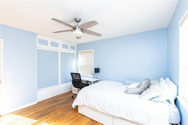 bedroom featuring ceiling fan and wood finished floors