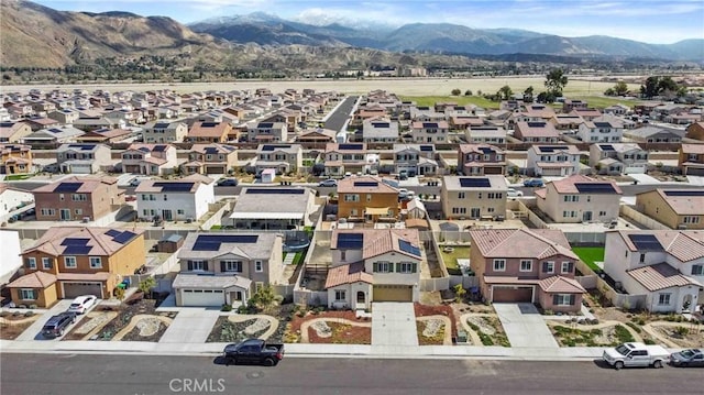 drone / aerial view featuring a residential view and a mountain view