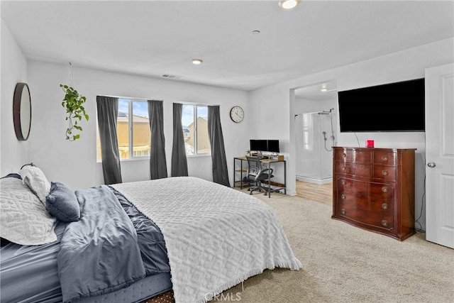 bedroom featuring visible vents and carpet flooring