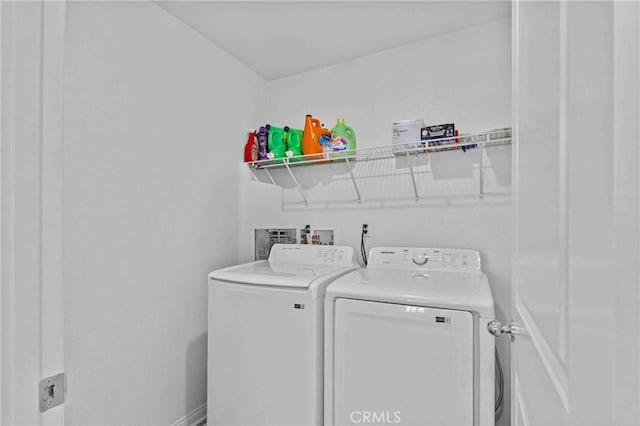 washroom with laundry area and washer and clothes dryer