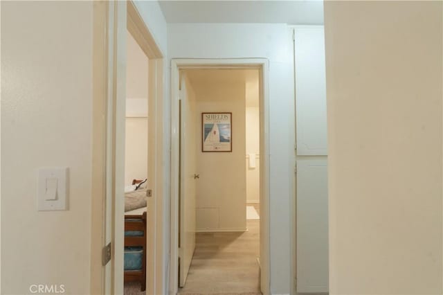 corridor with light wood-style flooring