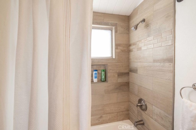 bathroom with shower / bath combination with curtain