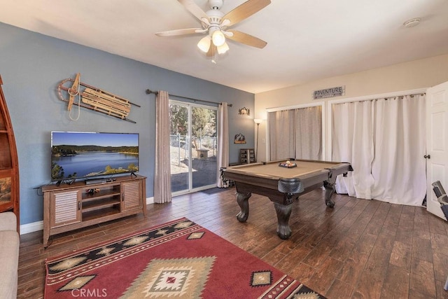 game room featuring pool table, hardwood / wood-style floors, a ceiling fan, and baseboards