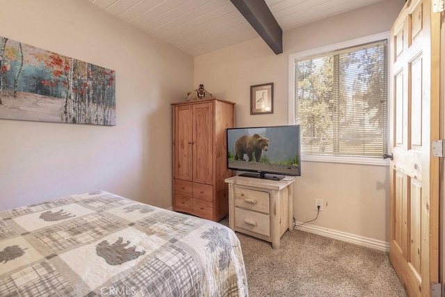 bedroom featuring wood ceiling, light carpet, beamed ceiling, and baseboards