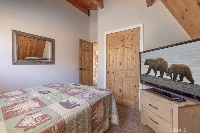 carpeted bedroom featuring beamed ceiling and a high ceiling