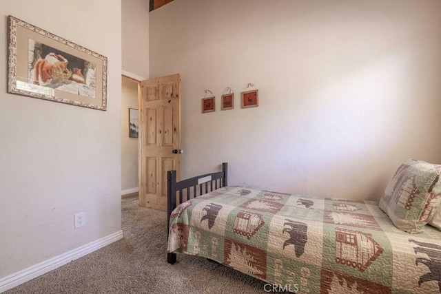 carpeted bedroom with baseboards