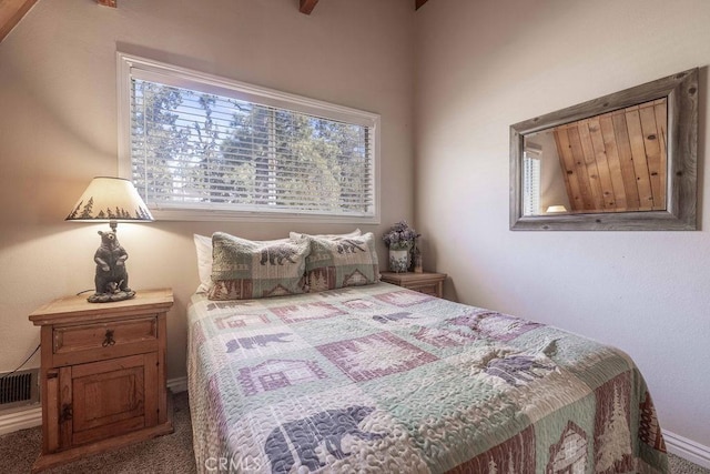 carpeted bedroom featuring visible vents