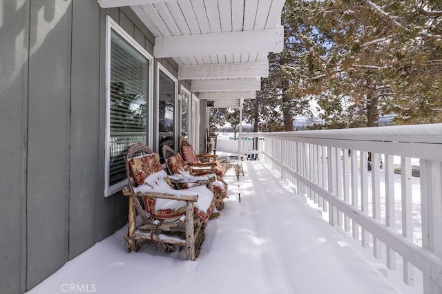 view of snow covered patio