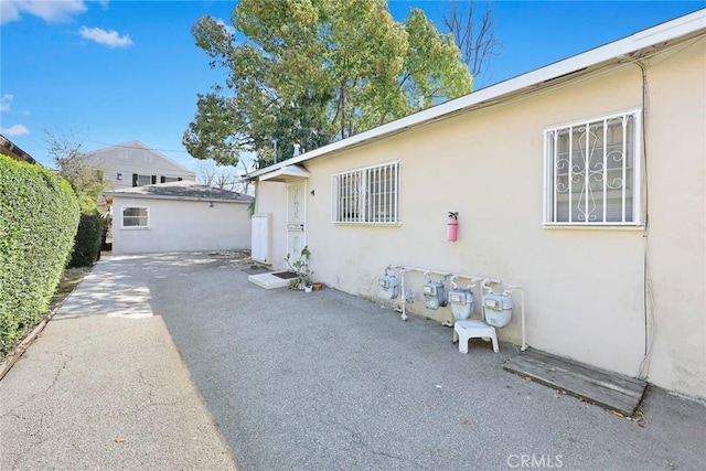 view of property exterior with a patio area and stucco siding