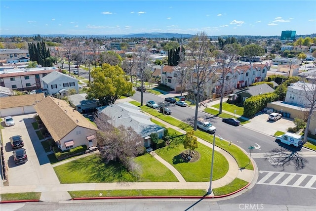 birds eye view of property with a residential view