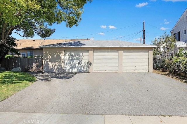 garage featuring fence