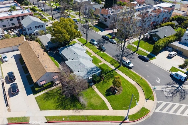 birds eye view of property with a residential view