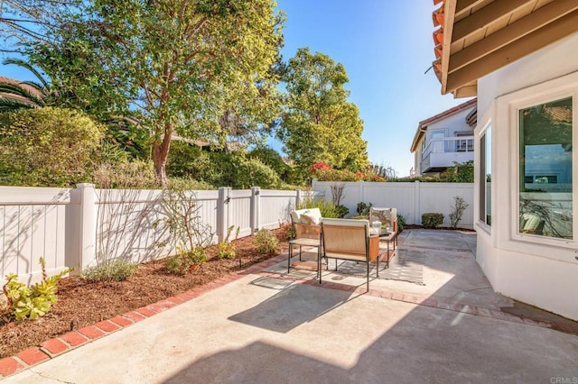 view of patio / terrace featuring a fenced backyard and outdoor dining space