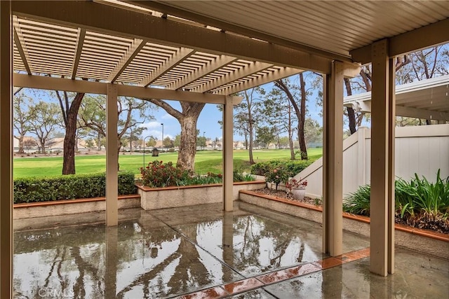 view of patio with a pergola and fence