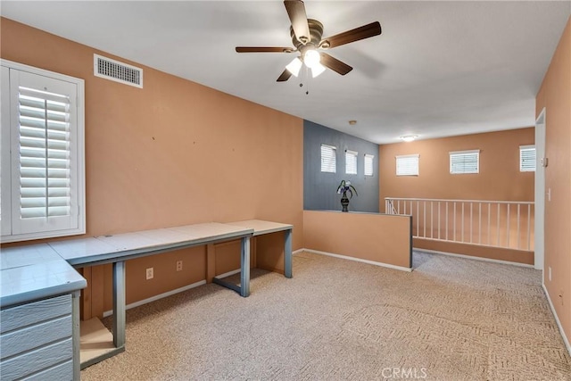 office with visible vents, baseboards, carpet, and ceiling fan