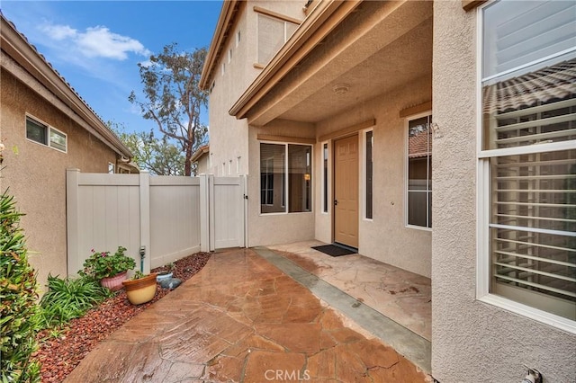 view of patio featuring fence