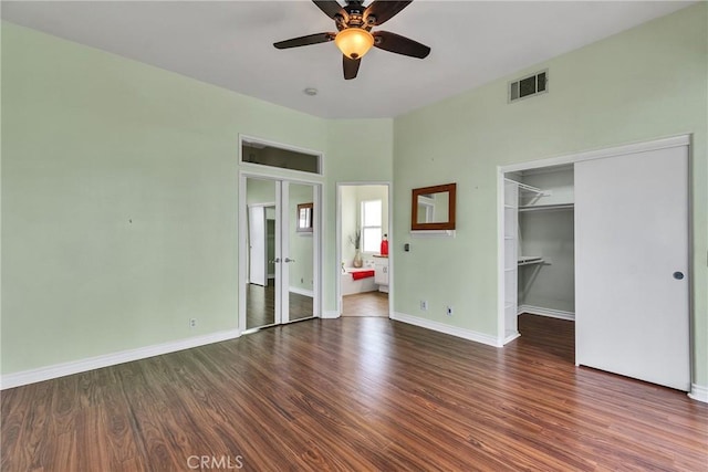 unfurnished bedroom featuring visible vents, french doors, baseboards, and wood finished floors