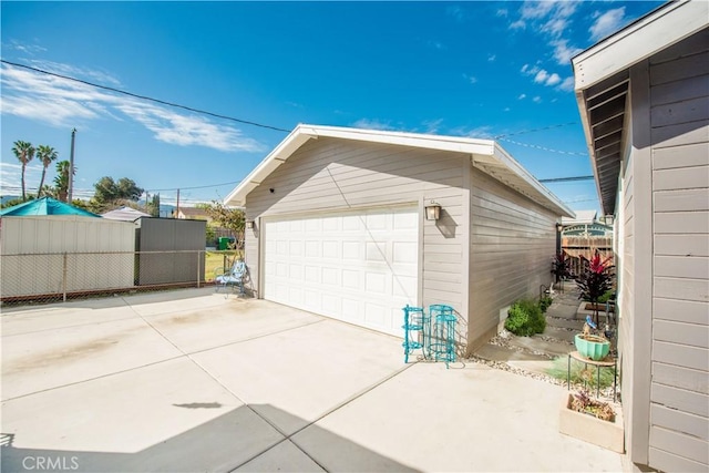 detached garage with fence