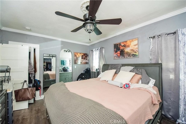 bedroom with dark wood-style floors, ceiling fan, and crown molding