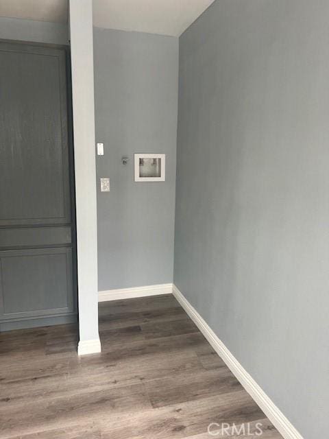 washroom featuring washer hookup, electric dryer hookup, baseboards, and wood finished floors