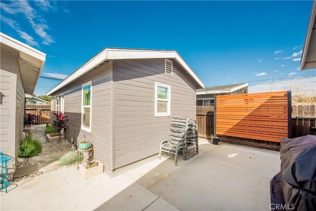 exterior space featuring fence and an outdoor structure