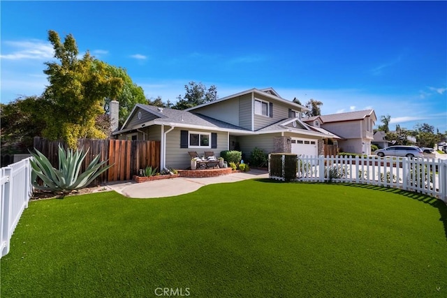 traditional home with a fenced backyard, concrete driveway, a garage, and a front lawn