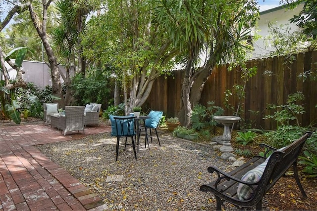 view of yard with a patio area and a fenced backyard