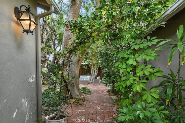 view of home's exterior featuring a patio, fence, and stucco siding