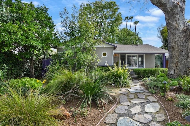 ranch-style home with stucco siding