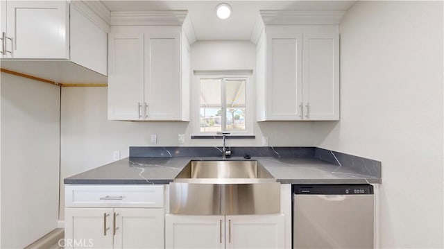 kitchen featuring white cabinets, dishwasher, and a sink