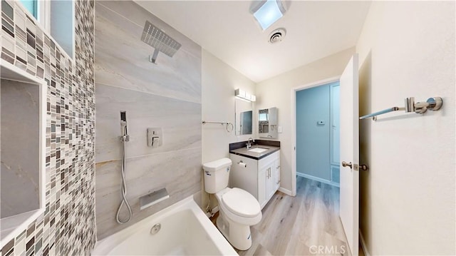 full bath with visible vents, vanity, toilet, and wood finished floors