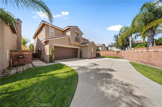 view of front of home featuring a garage, fence, driveway, and stucco siding