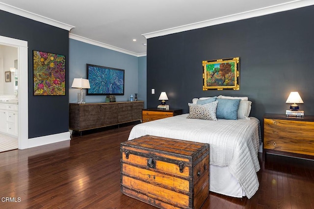 bedroom with ornamental molding, baseboards, ensuite bath, and wood finished floors