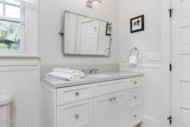 bathroom featuring wainscoting and vanity