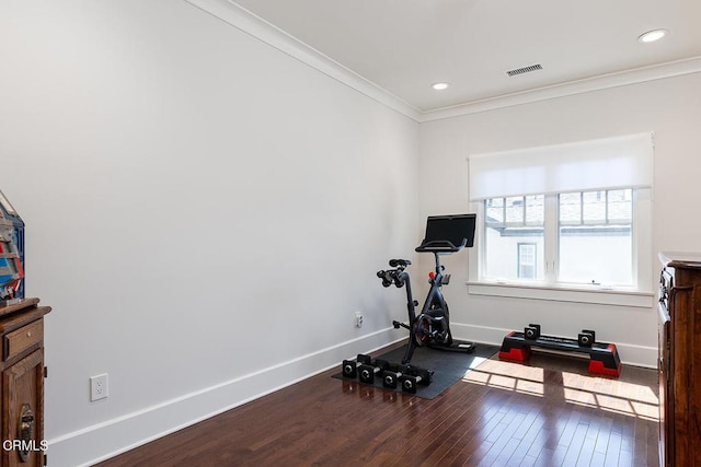 exercise room with recessed lighting, wood finished floors, visible vents, baseboards, and ornamental molding