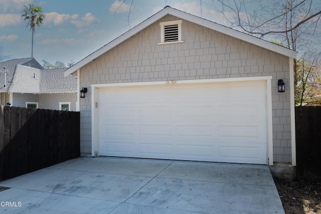 garage featuring fence