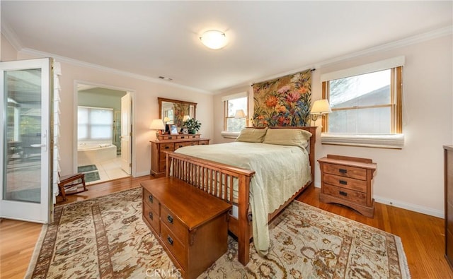 bedroom featuring multiple windows, wood finished floors, and crown molding