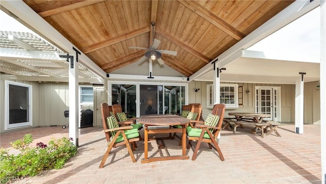 view of patio / terrace with outdoor dining area, a ceiling fan, and a pergola