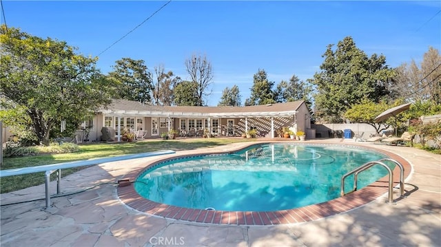 view of swimming pool with a lawn, fence, a fenced in pool, and a patio