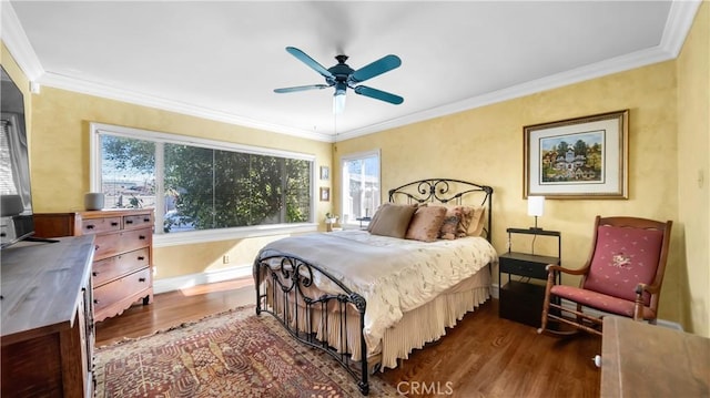 bedroom with baseboards, ceiling fan, dark wood-style flooring, and crown molding