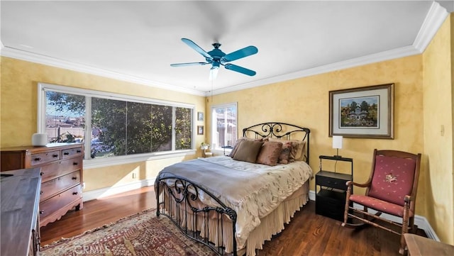 bedroom with ceiling fan, ornamental molding, dark wood-style flooring, and baseboards