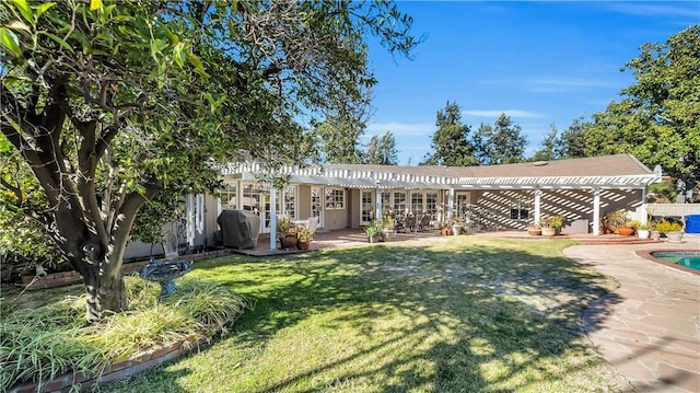 view of front of property with a patio area, an outdoor pool, a front lawn, and a pergola