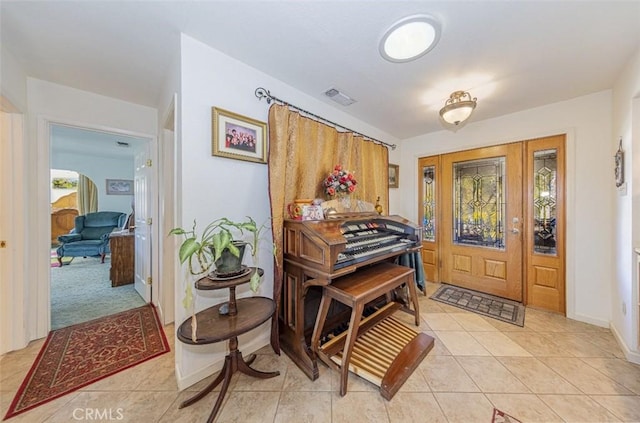 45544 Pine River Rd, Ahwahnee, CA 93601 - foyer with visible vents, baseboards, and light tile patterned flooring