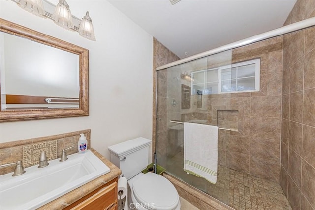45544 Pine River Rd, Ahwahnee, CA 93601 - bathroom featuring a stall shower, vanity, and toilet